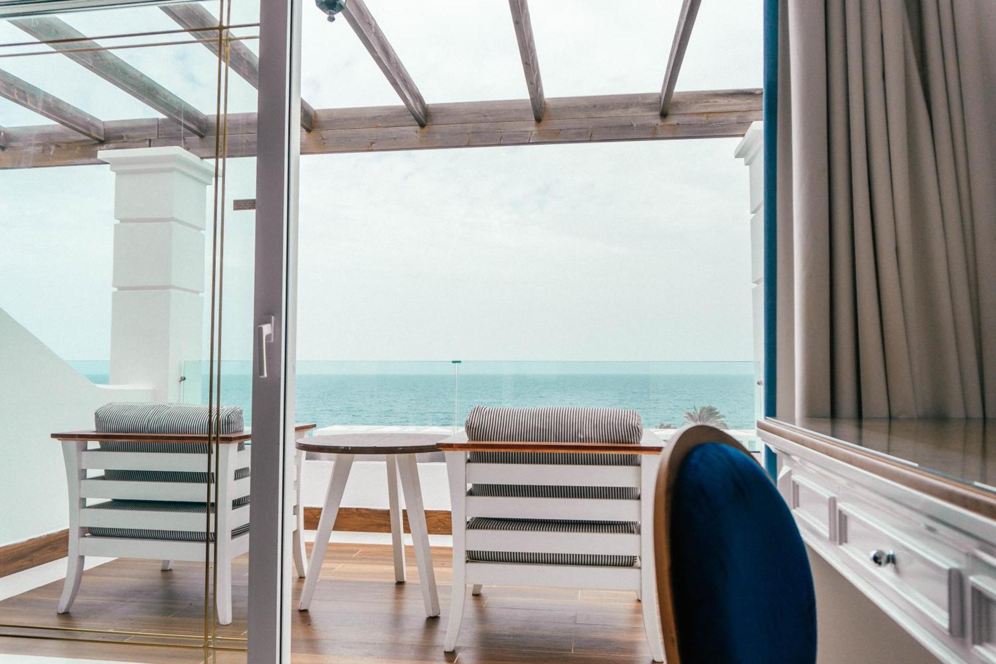 Minos Imperial Luxury Beach Resort & Spa Milatos Zewnętrze zdjęcie A view from the balcony of a suite on board the World Voyager